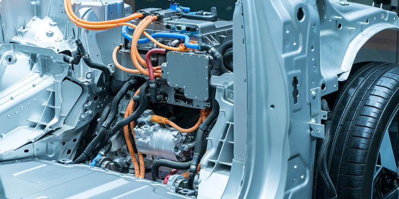 Battery and wire installed on electric system of eco car engine, Automotive part concept.